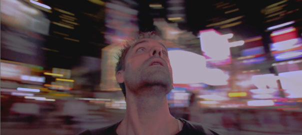 A man looks up at lights