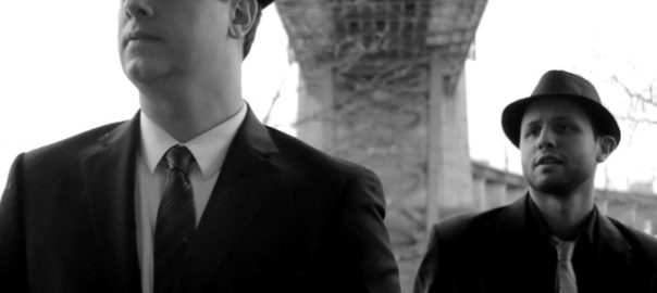 A black and white image of two men in suits