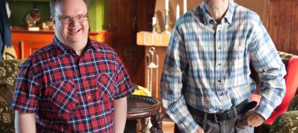 Two man stand in a room