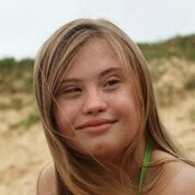 A girl sitting on a beach