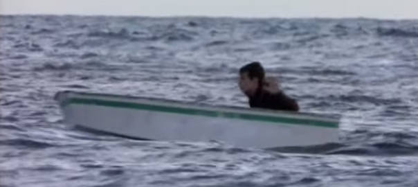 A person in a boat on open water