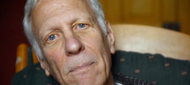 A man looks at the camera