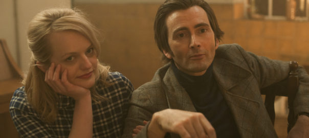 A man and woman in 60s clothes are sitting down with drinks